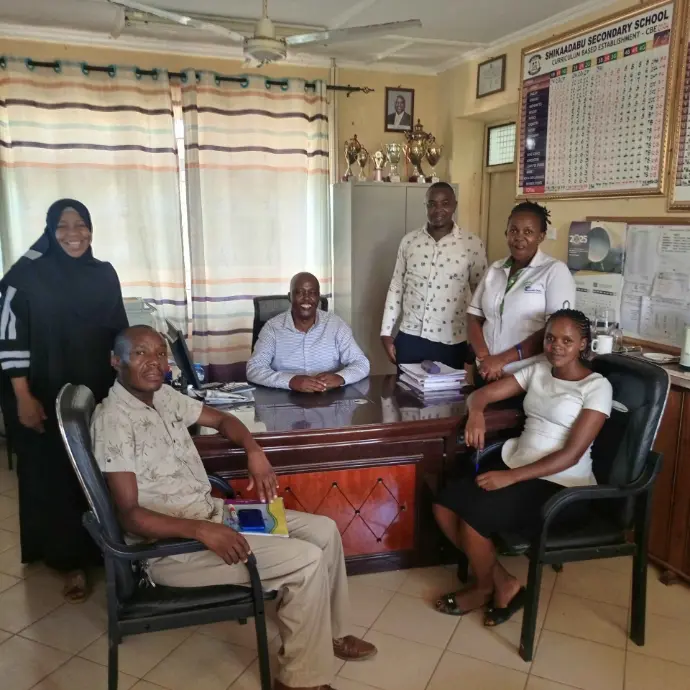 Shikaadabu Secondary School teachers in the principal&#39;s office.